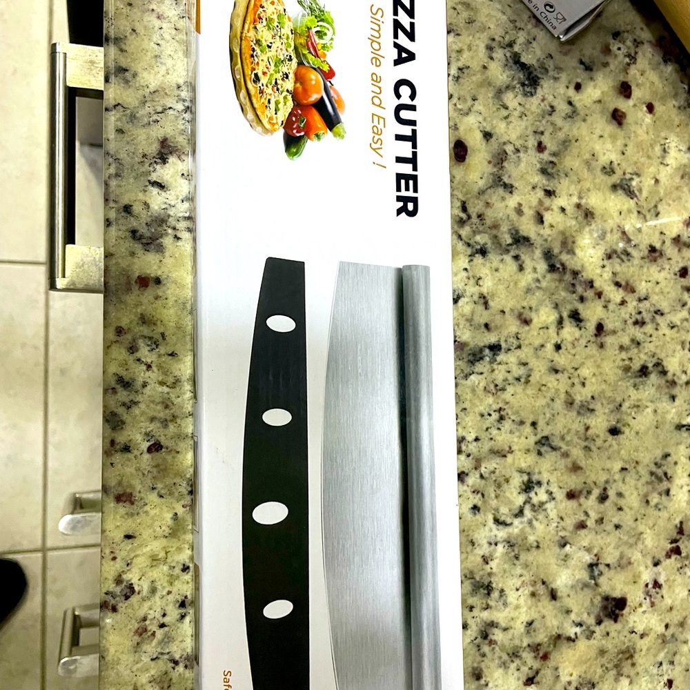Large pizza cutter new 
In original box